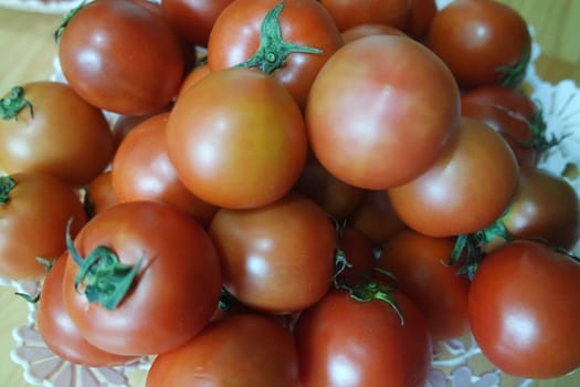 Close-up view of red tomatoes in market for sale. A fruit background for text and advertisements