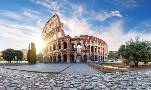 Roman Coliseum at sunset, summer view with no people, Italy.