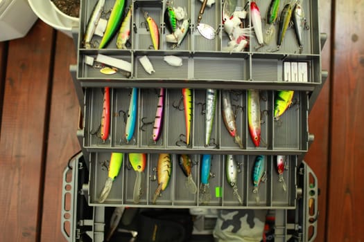 fisherman is inspects, checks the the fishing box