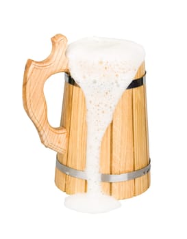 Wooden beer mug with beer isolated on white