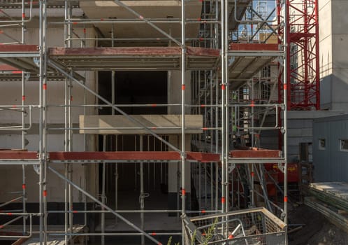 construction site new building facade with scaffold