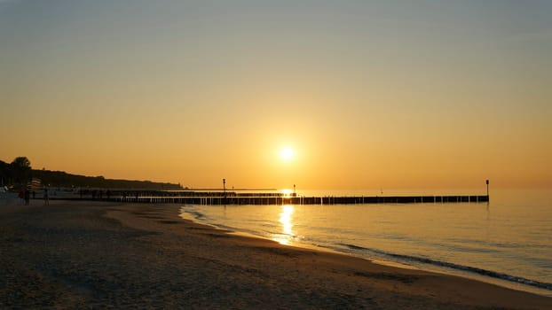 Evening atmosphere on the beach of the Polish Baltic coast near Kolobrzeg in the evening just before sunset