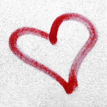Red heart hand drawn on concrete wall. Concept or conceptual painted red abstract heart shape love symbol, dirty wall background, metaphor to urban and romantic valentine, grungy style.