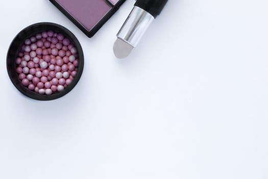 Chocolate-colored bronzer, blush balls and concealer background with space for text. top view, flat lay, copy space, isolate. High quality photo