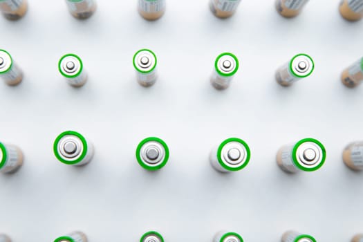 The batteries are arranged in a triangle in the upper corner of the photo on a white background. top view, flat lay, copy space, isolate. High quality photo