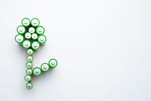 The batteries are in the shape of a flower on a white background. top view, flat lay, copy space, isolate. High quality photo