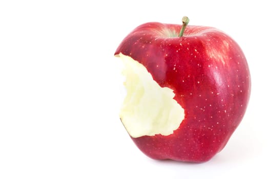Red bitten apple on white background. Copy-space.