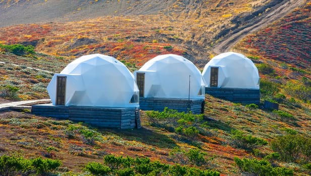 The White glamping on the slope of a volcano in autumn on the Kamchatka Peninsula