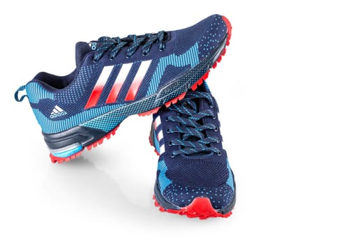 Kamchatka, Russia - September 22, 2021: Blue Adidas Running Sneakers. Adidas, Germany company. Isolated on white.