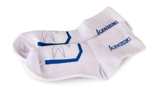 Kamchatka, Russia: August 29, 2021: Kawasaki sign on a white socks Kawasaki is a Japanese public multinational corporation primarily known as a manufacturer of motorcycles, heavy equipment, aerospace and defense