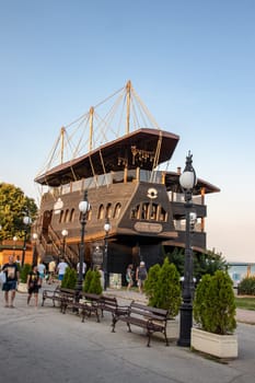 Golden Sands, Bulgaria - SEP 11, 2021. A view of the pirate ship Black Pearl Restaurant on Paradise Beach. The resort is a popular summer destination on the Black Sea coast near the city of Varna.