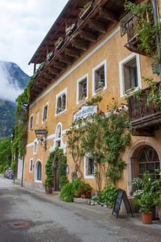 Hallstatt: June 11, 2021  street in famous Hallstatt mountain village with Hallstatter lake See