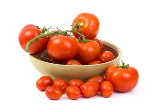 fresh tomatoes in a bowl on white background