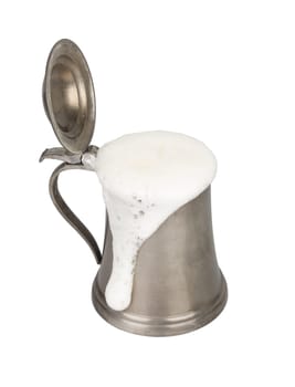 Metallic beer mug with beer isolated on white