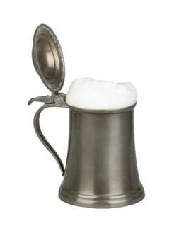 Metallic beer mug with beer isolated on white