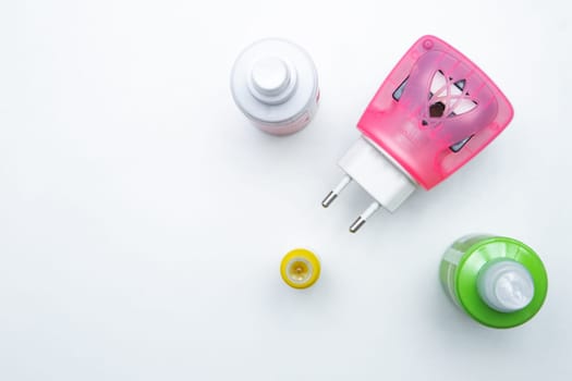 Mosquito repellents are lying in a corner on a white background. High quality photo