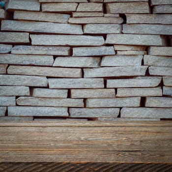 The background is blank wooden boards and a textured brick wall with lighting and vignetting. For product demonstrations, free space, layout, mockup, perspective board, background board.