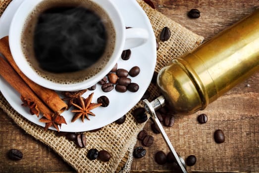 Cup of coffee and coffee mill