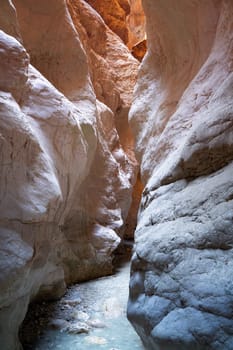 vertical front view of canyon natural rock formation with light shining in Saklikent national park Turkey