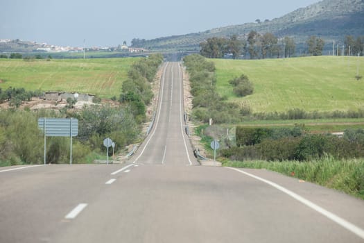 Local road full of change of slopes or gradient changes. Driving along La Serena, Extremaduran southeast, Spain