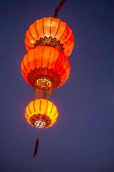 Traditional chinese restaurant paper lantern. Dusk background