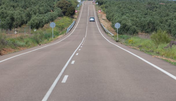 Local road full of change of slopes or gradient changes. Driving along La Serena, Extremaduran southeast, Spain