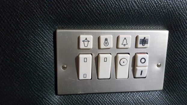 Seventies style switch panel for hotel. Closeup