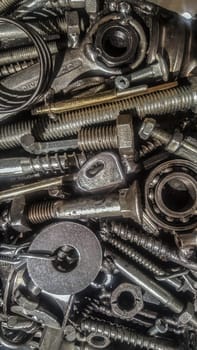 Jumble of used metal pieces as a old hex keys or bolts. Closeup
