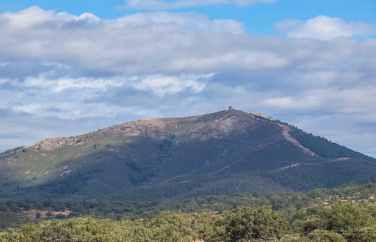Fire lookout tower over forest of Aceituna, rural village in Alagon Valley. Caceres, Extremadura, Spain
