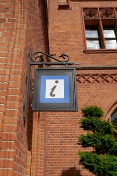 Tourist information sign at the town hall in the old town of Kolobrzeg in Poland