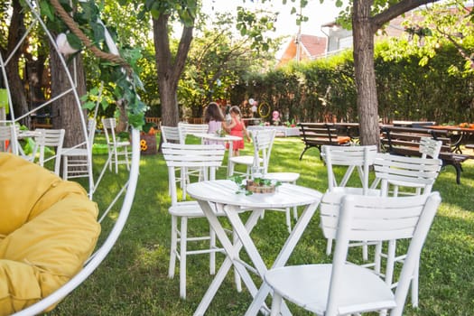 Beautiful birthday rustic decoration in summer garden, natural light, daylight , summertime