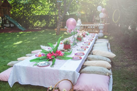 Beautiful birthday rustic setting for guest in summer garden, natural light, daylight , summertime