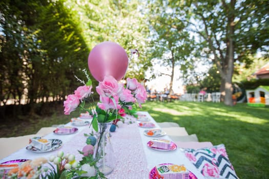 Beautiful birthday rustic setting for guest in summer garden, natural light, daylight , summertime