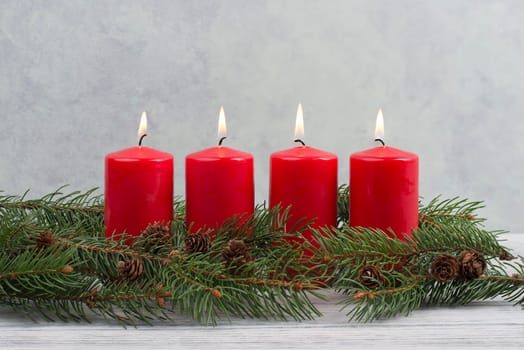 Red candles on a advent wreath, christmas decoration with candlelight