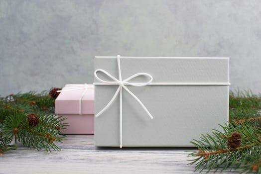 A gift parcel with christmas decoration, branch of fir, presents for the holiday, empty copy space