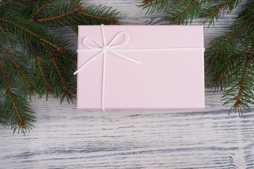 A gift parcel with christmas decoration, branch of fir, presents for the holiday, empty copy space