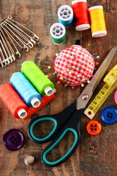 Composition with tailor accessories on wooden table