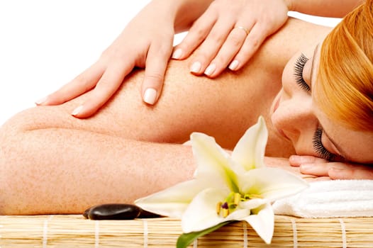 Young beautiful woman enjoying spa massage