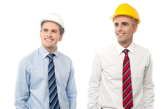 Smiling male engineers looking at copy space