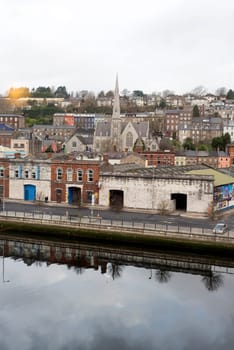 Cork city buildings beside the river Lee in Ireland