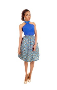A beautiful slim African American woman standing in a lovely skirt.and blue blouse isolated for white background..