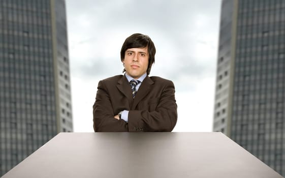 young worried business man on a desk