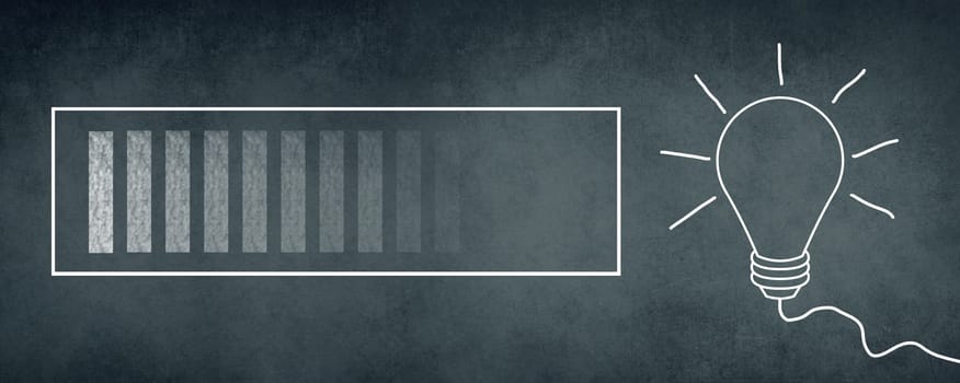 Loading sign and a lightbulb drawn on a chalkboard, brainstorming for new ideas, dark texture