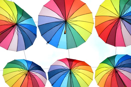 Colorful rainbow parasols. The rainbow colors stand as a symbol for the acceptance and equality of people who live a different sexuality than the heterosexuality. LGBT LGBTI LGBT CSD