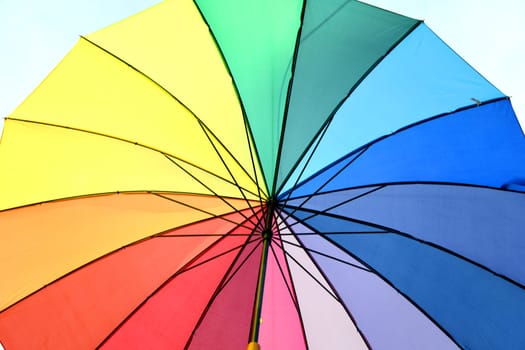 A colorful rainbow umbrella. The rainbow colors stand as a symbol for the acceptance and equality of people who live a different sexuality than the hetrosexuality. LGBT LGBTI LGBT CSD
