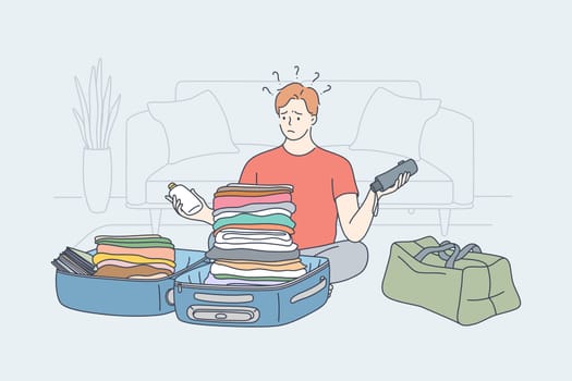 Travelling, problem, hiking, holiday, thought concept. Young pensive thoughtful man guy traveler hiker packs backpack thinking about equipment to put in. Active lifestyle recreation problem of choice.