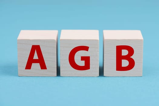 The word AGB is standing on wooden cubes, german language, general terms and conditions for businesses