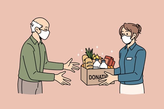 Charity and donating food concept. Young woman volunteer in medical protective mask giving Box with donation word full of products food for elderly man vector illustration