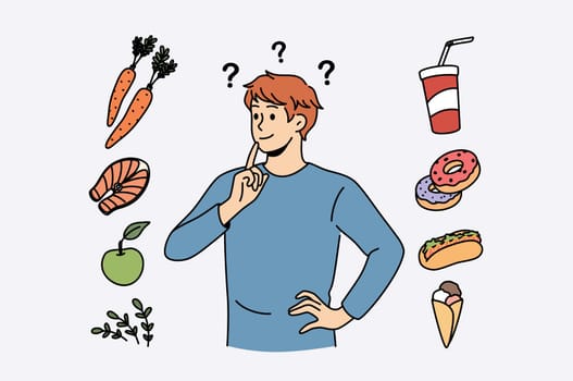 Food and diet choice concept. Young smiling man cartoon character standing trying to choose between healthy food and fat junk fast foods