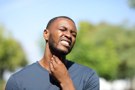Black man complaining about throat ache